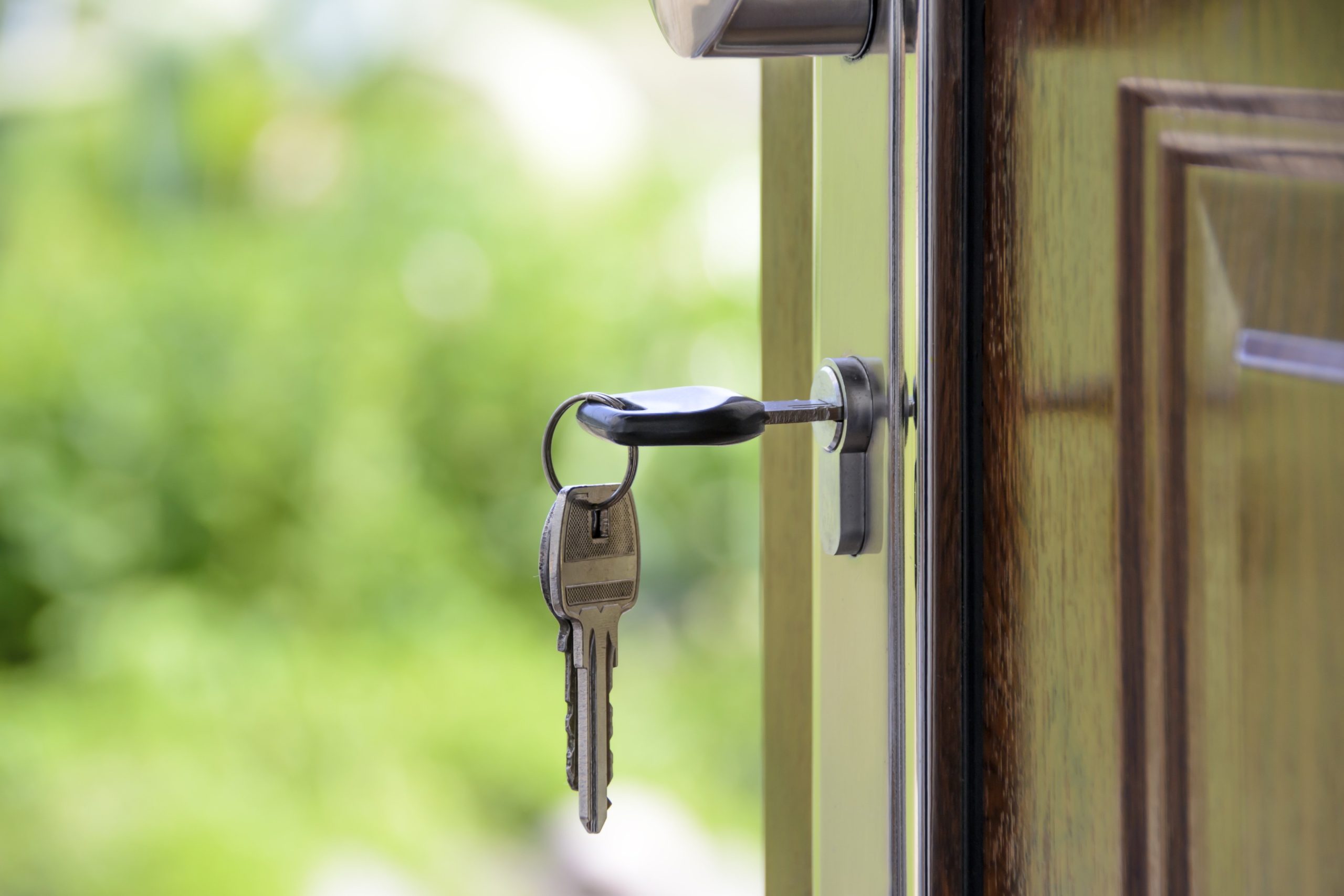 House key placed in door lock