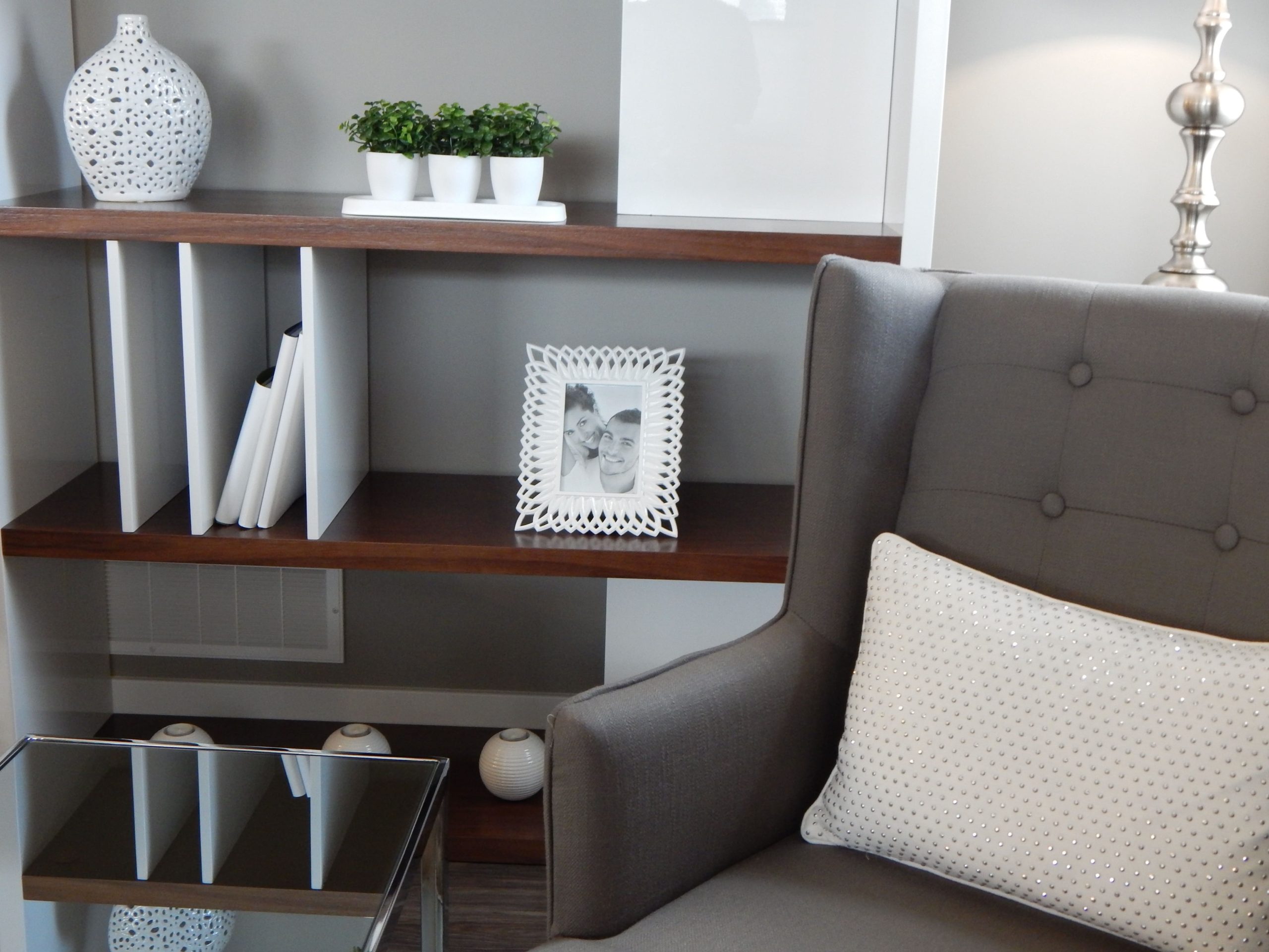 Shelving unit behind chair in home