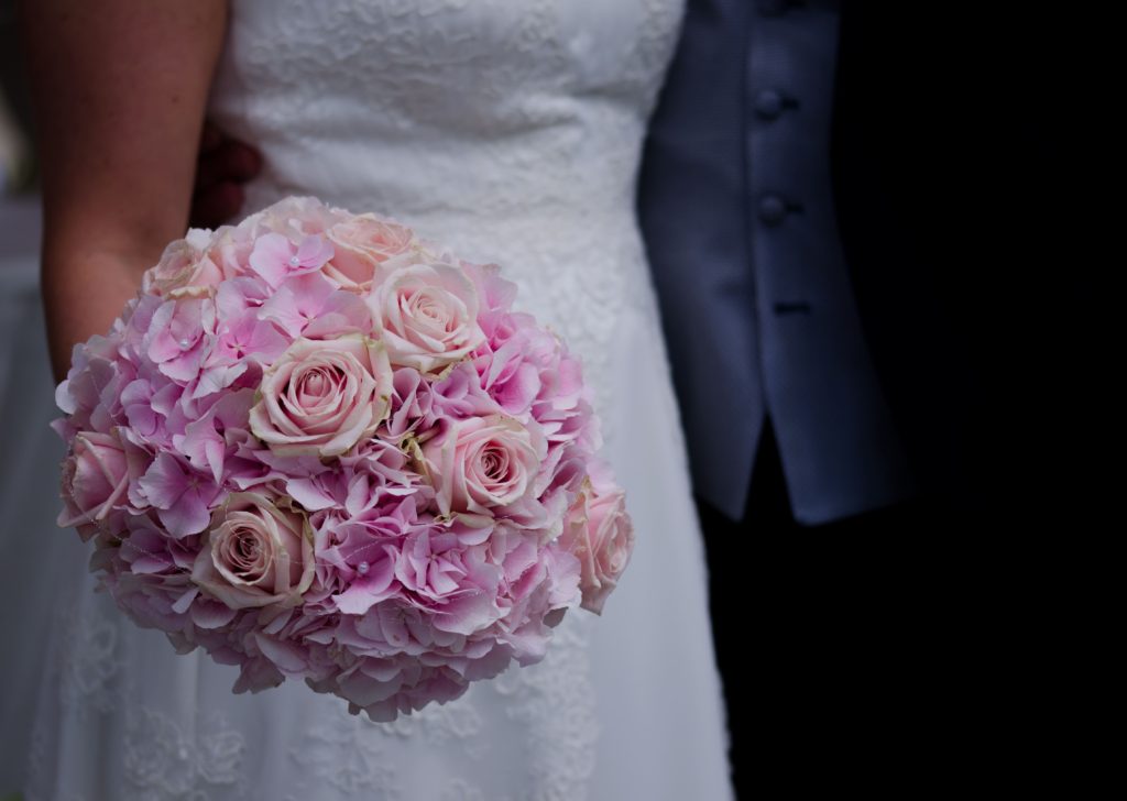 Wedding dress with pink bouquet