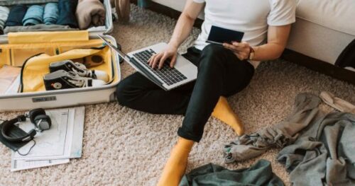 student sat on floor with mess