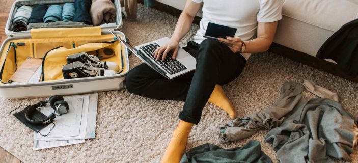 student sat on floor with mess