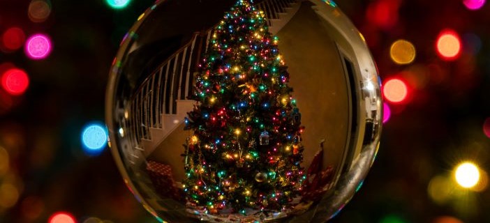 christmas tree through a glass bauble